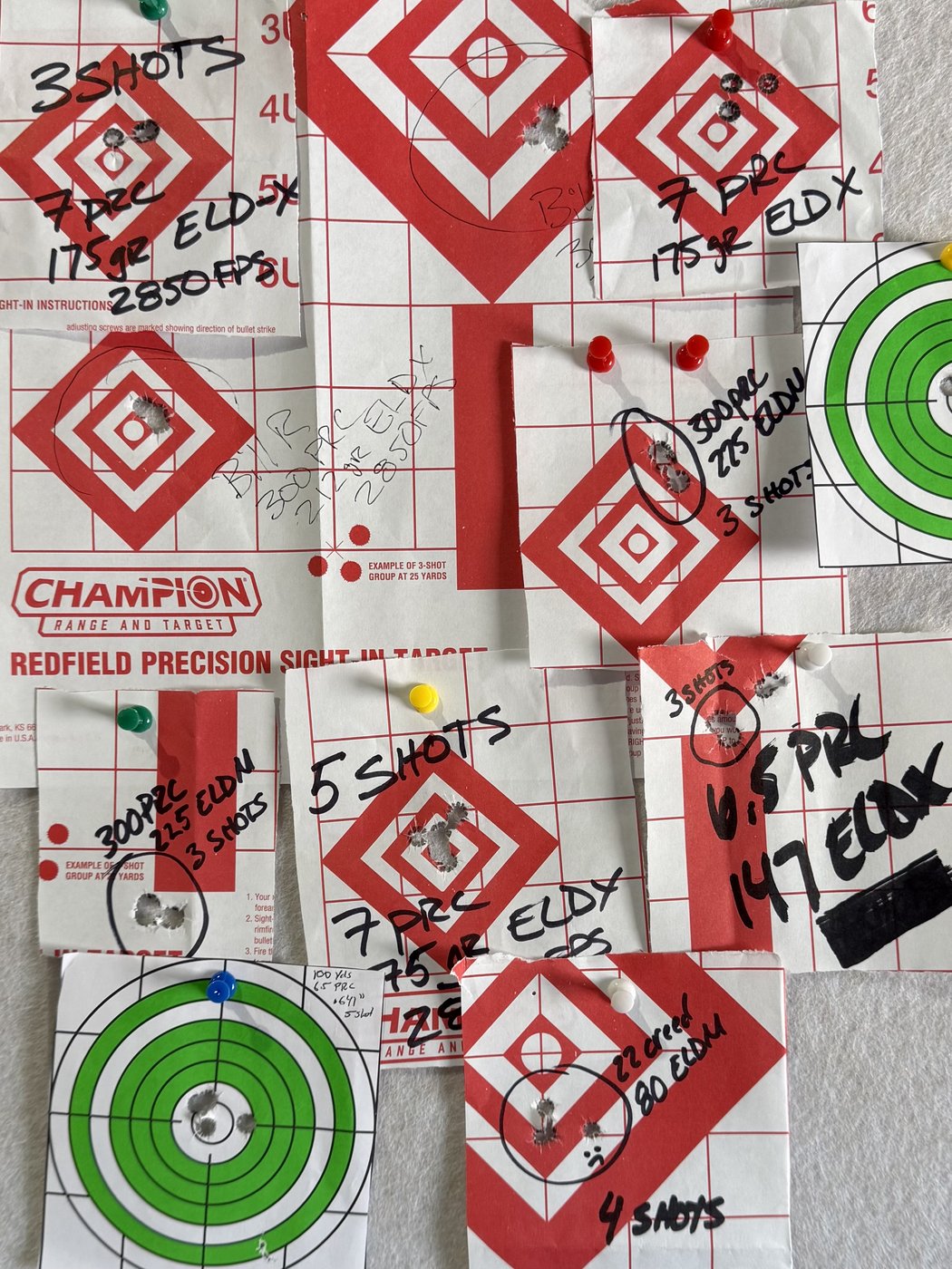 Collage of shot targets, each showing a sub-MOA grouping from a Western Pursuit custom rifle build